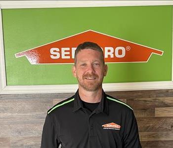 Mike standing in front of Servpro sign