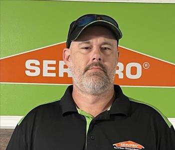 Ashley Powell standing in front of Servpro Sign