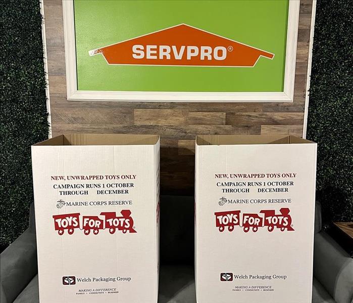 Toys for Tots boxes in front of SERVPRO sign